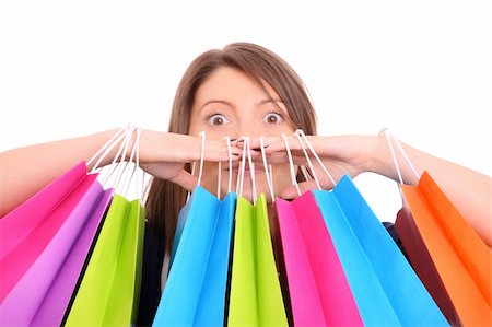 studio portrait attractive woman surprised - A picture of a young happy woman among shopping bags over white background Stock Photo - Budget Royalty-Free & Subscription, Code: 400-06172190
