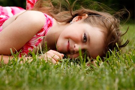 Cute little girl on the meadow in spring day Stock Photo - Budget Royalty-Free & Subscription, Code: 400-06172348