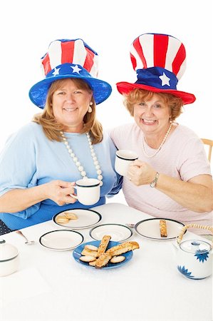 Patriotic conservative American voters sitting down to an actual tea party.  White background Foto de stock - Super Valor sin royalties y Suscripción, Código: 400-06172886