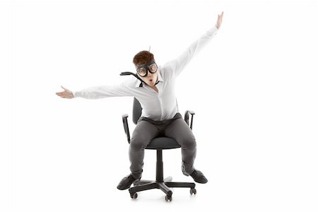 pilot pose - Image of a funny young man on chair Stock Photo - Budget Royalty-Free & Subscription, Code: 400-06173185