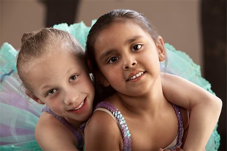 Young ballet student gives her friend a hug Stock Photo - Budget Royalty-Free & Subscription, Code: 400-06173373