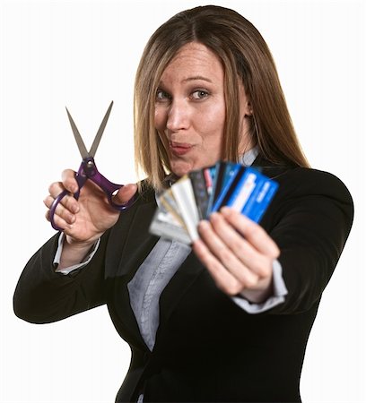 Businesswoman with scissors and stack of credit cards Stock Photo - Budget Royalty-Free & Subscription, Code: 400-06173396