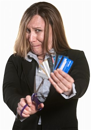 Nervous businesswoman with scissors and credit cards Stock Photo - Budget Royalty-Free & Subscription, Code: 400-06173399