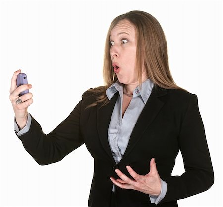 Shocked professional lady with telephone over white background Stock Photo - Budget Royalty-Free & Subscription, Code: 400-06173390