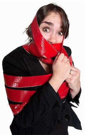 Scared businesswoman wrapped in red tape over white background Stock Photo - Budget Royalty-Free & Subscription, Code: 400-06173403