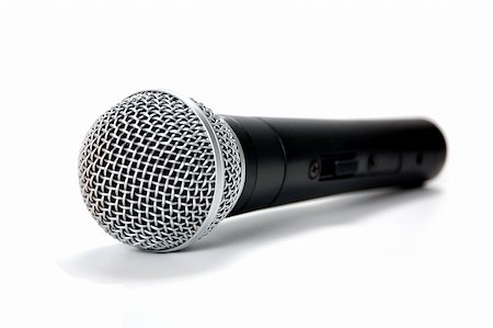 simple black microphone  on a white background close up Stock Photo - Budget Royalty-Free & Subscription, Code: 400-06173450