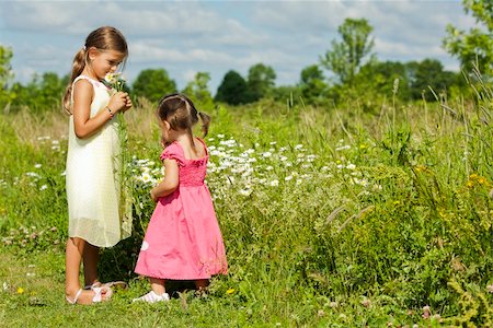 simsearch:400-05248187,k - girl toddler is having fun smelling flower in the summer Photographie de stock - Aubaine LD & Abonnement, Code: 400-06173834