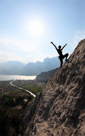 Silhouette of a female rock climber with outstretched arms, near Arco, North-Italy Stock Photo - Budget Royalty-Free & Subscription, Code: 400-06173990