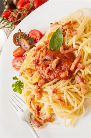 fine spaghetti with tomato bacon and cheese with basil leaves Stock Photo - Budget Royalty-Free & Subscription, Code: 400-06199989