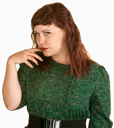 simsearch:693-03315149,k - Skeptical woman with finger in mouth over white background Stock Photo - Budget Royalty-Free & Subscription, Code: 400-06204604