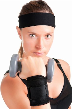 simsearch:400-06480028,k - Woman working out with dumbbells at a gym Stock Photo - Budget Royalty-Free & Subscription, Code: 400-06204743