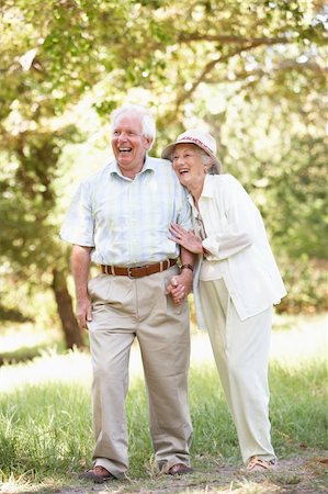 Senior Couple Walking In Park Stock Photo - Budget Royalty-Free & Subscription, Code: 400-06204769