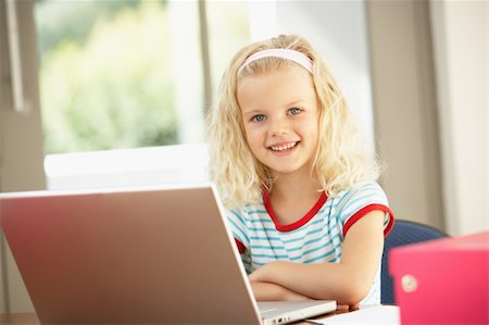 Young Girl Using Laptop At Home Stock Photo - Budget Royalty-Free & Subscription, Code: 400-06205053