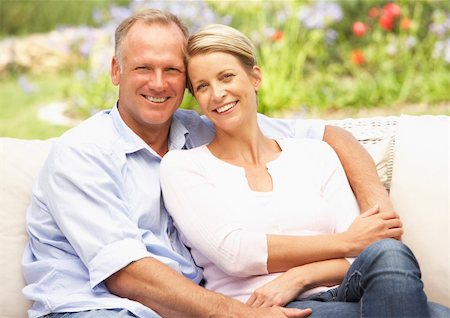 Couple Relaxing In Garden Stock Photo - Budget Royalty-Free & Subscription, Code: 400-06205075