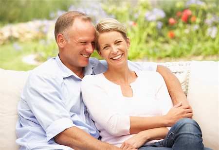 Couple Relaxing In Garden Stock Photo - Budget Royalty-Free & Subscription, Code: 400-06205076