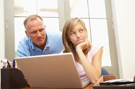 Angry Father And Teenage Daughter Using Laptop At Home Photographie de stock - Aubaine LD & Abonnement, Code: 400-06205149