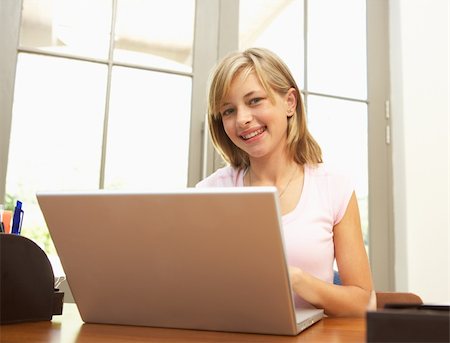 simsearch:400-04044137,k - Teenage Girl Using Laptop At Home Stock Photo - Budget Royalty-Free & Subscription, Code: 400-06205151