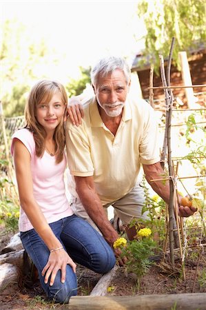 Teenage Granddaughter And Grandfather Relaxing In Garden Stock Photo - Budget Royalty-Free & Subscription, Code: 400-06205163