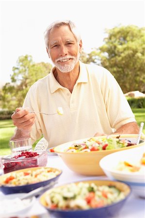 senior man eating table not woman - Senior Man Enjoying Meal In Garden Stock Photo - Budget Royalty-Free & Subscription, Code: 400-06205194