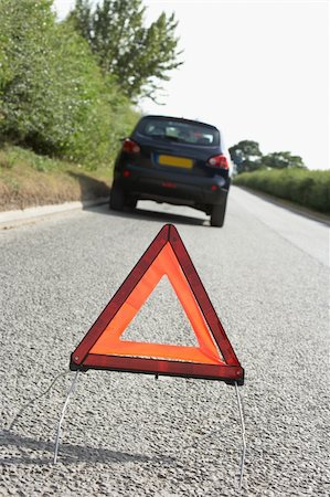Car Broken Down On Country Road With Hazard Warning Sign In Foreground Stock Photo - Budget Royalty-Free & Subscription, Code: 400-06205203