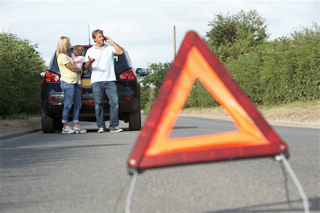 Family Broken Down On Country Road With Hazard Warning Sign In Foreground Stock Photo - Budget Royalty-Free & Subscription, Code: 400-06205215
