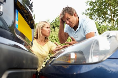 Man And Woman Having Argument After Traffic Accident Stock Photo - Budget Royalty-Free & Subscription, Code: 400-06205255