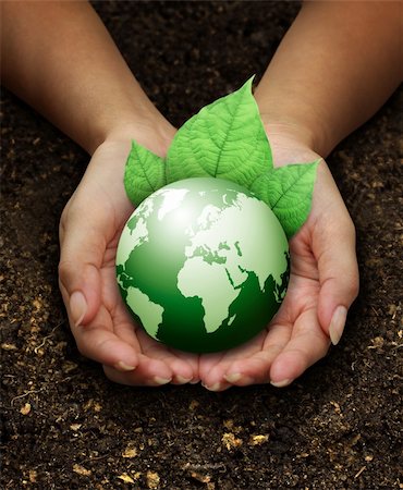 earth ecology concept - human hands holding green earth with a leaf on soil background Stock Photo - Budget Royalty-Free & Subscription, Code: 400-06205341