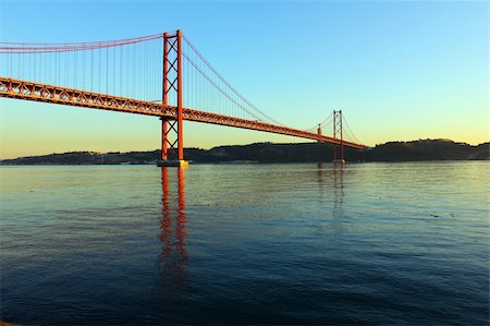 The Tagus River and the Bridge are two of the most important landmarks of Lisbon. Fotografie stock - Microstock e Abbonamento, Codice: 400-06205783