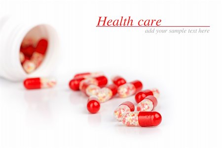 red pills isolated on a white background Stock Photo - Budget Royalty-Free & Subscription, Code: 400-06205965