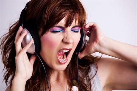 portrait screaming girl - Studio fashion portrait of a young woman listen music Stock Photo - Budget Royalty-Free & Subscription, Code: 400-06206120
