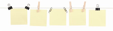 Five blank yellow sticky notes held on a string by various clips isolated on white. Stock Photo - Budget Royalty-Free & Subscription, Code: 400-06207032