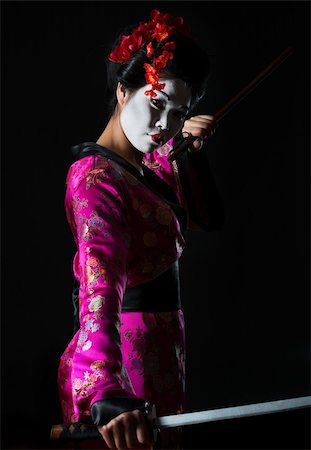 Portrait of geisha holding sword isolated on black Stock Photo - Budget Royalty-Free & Subscription, Code: 400-06207747