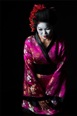 simsearch:400-05383537,k - Portrait of geisha welcome with respect isolated on black Stock Photo - Budget Royalty-Free & Subscription, Code: 400-06207741