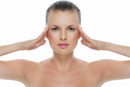 Beauty portrait of young woman with hands on temples isolated on white Stock Photo - Budget Royalty-Free & Subscription, Code: 400-06207775