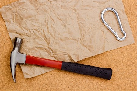 Directly above photograph of a hammer and a crumbled paper for text. Stock Photo - Budget Royalty-Free & Subscription, Code: 400-06208191