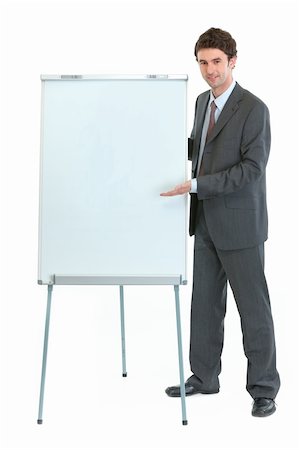 Full length portrait of businessman near flipchart stand Stock Photo - Budget Royalty-Free & Subscription, Code: 400-06208505