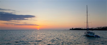 sailboat silhouette - Panoramic image of a yacht sailing at sundown Stock Photo - Budget Royalty-Free & Subscription, Code: 400-06201185