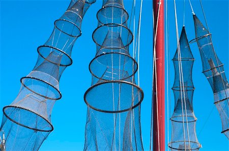 fykes for catching eel hanging on a ship for drying Stock Photo - Budget Royalty-Free & Subscription, Code: 400-06201627