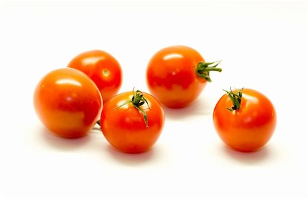 Some tomatos isolated on white background Foto de stock - Royalty-Free Super Valor e Assinatura, Número: 400-06201910