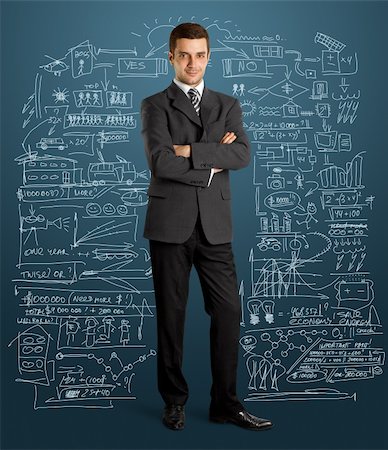 fashionable office worker full length - business man in suit full-length, looking on camera, with folded hands Stock Photo - Budget Royalty-Free & Subscription, Code: 400-06202329