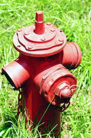 A red Fire Hydrant on the green grassland Fotografie stock - Microstock e Abbonamento, Codice: 400-06203142