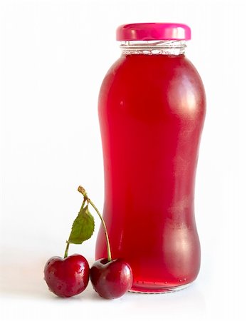 Bottle with cherry juice on white background Foto de stock - Super Valor sin royalties y Suscripción, Código: 400-06203303