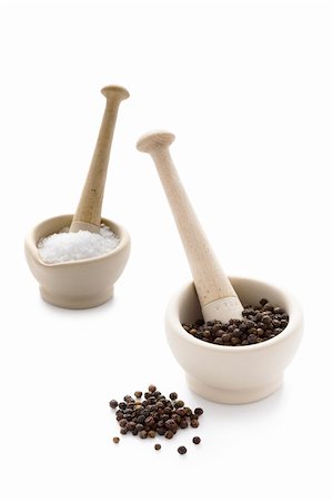 salt and pepper - salt crystals and black peppercorns in pestle and mortar Stock Photo - Budget Royalty-Free & Subscription, Code: 400-06203482