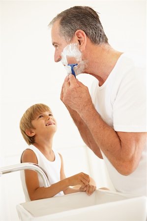 Grandson Watching Grandfather Shaving In Bathroom Mirror Stock Photo - Budget Royalty-Free & Subscription, Code: 400-06203545