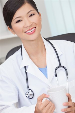 doctors coffee - A Chinese Asian female medical doctor drinking tea or coffee in a hospital office Stock Photo - Budget Royalty-Free & Subscription, Code: 400-06203885