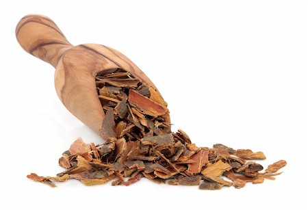 Buckthorn bark in an olive wood scoop over white background. Used in alternative medicine. Stock Photo - Budget Royalty-Free & Subscription, Code: 400-06327236