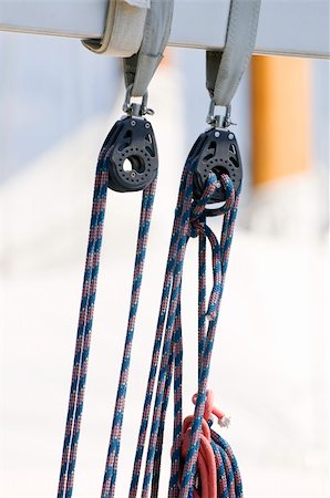 sailing block pulley - Two blocks - nautical pulleys - on a modern sailboat Stock Photo - Budget Royalty-Free & Subscription, Code: 400-06327737
