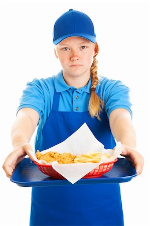 Serious teenage girl serving a fast food meal.  Isolated on white. Stock Photo - Budget Royalty-Free & Subscription, Code: 400-06327904