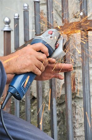 sfregare - Hands of metal worker with grinder producing Fotografie stock - Microstock e Abbonamento, Codice: 400-06327987