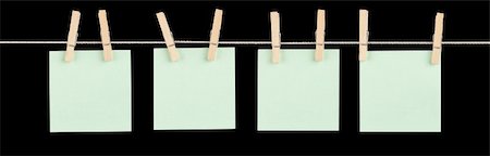 simsearch:400-06203504,k - Four blank green sticky notes held on a string with clothespins isolated on black. Stock Photo - Budget Royalty-Free & Subscription, Code: 400-06328014
